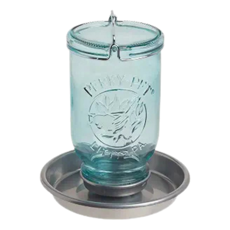 A glass jar-style pet waterer with a metal tray base,